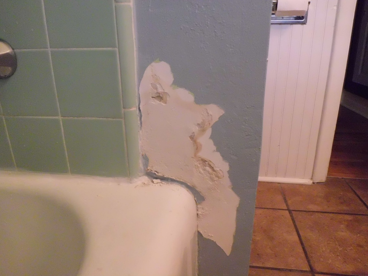 damaged bathroom wall